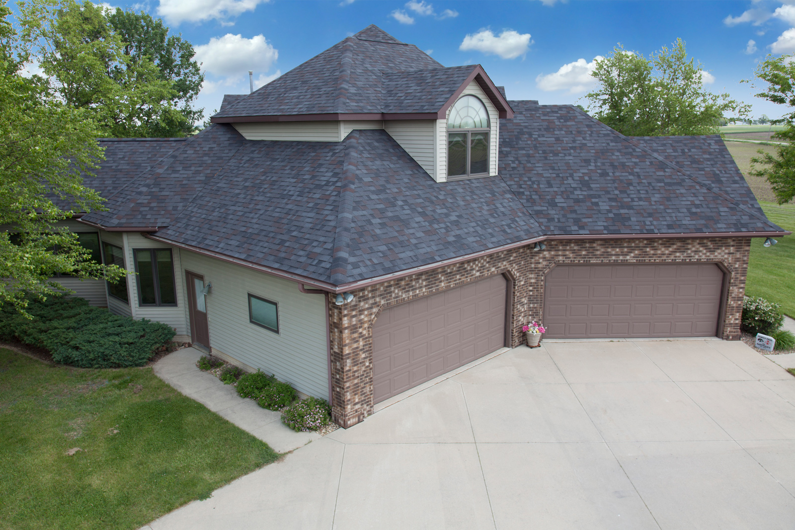 Photo of a house with Black Oak Malarkey Shingles installed